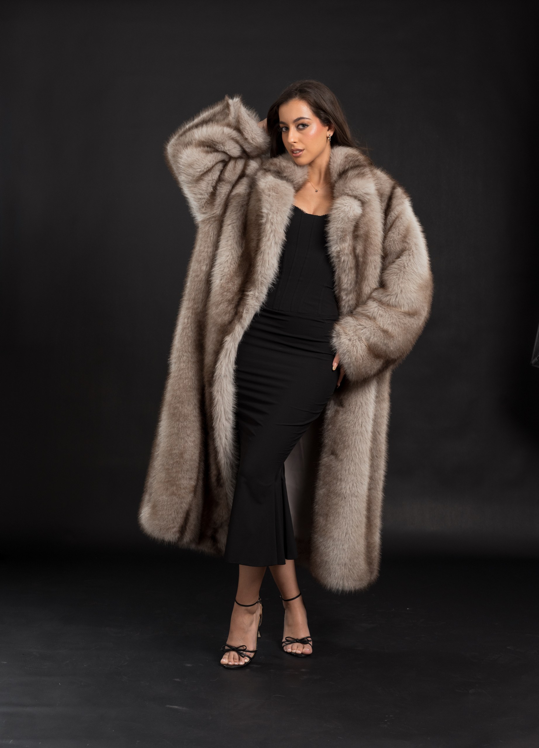 Bianca faux fur coat in silver grey, full length, worn open over a black dress, front view